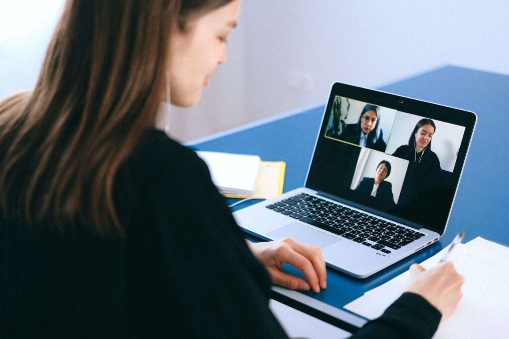 Woman attending a webinar from her computer